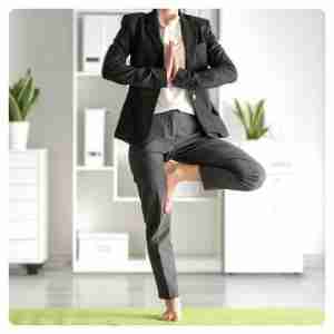 Busy Life Pain Relief: Stress & Posture Solutions - female taking a break in the office doing some yoga moves
